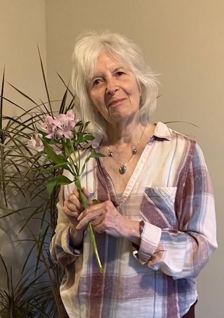 Joan holding a bouquet of flowers